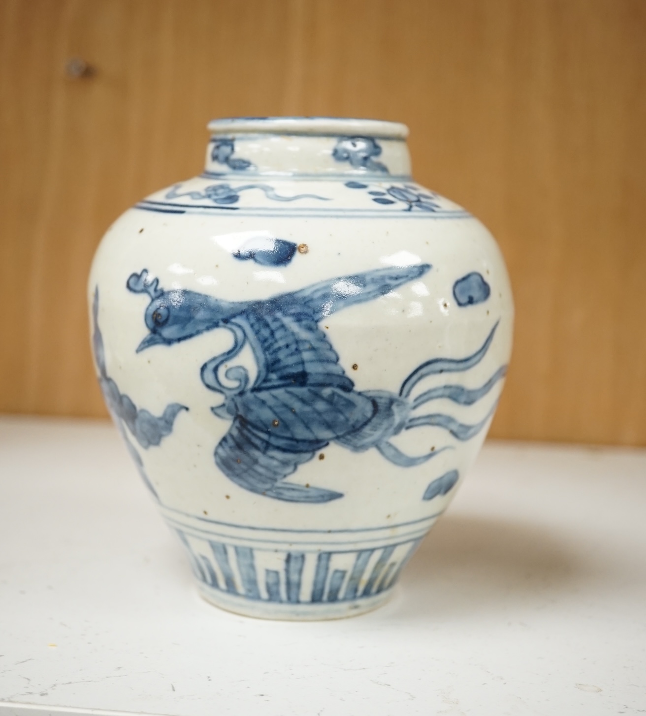 A Chinese late Ming blue and white ‘phoenix’ jar, Wanli period, decorated with phoenixes, 14cm high. Condition - good